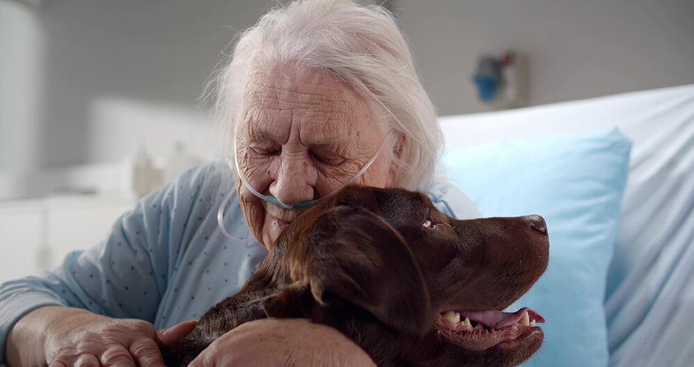older caucasian woman with dog
